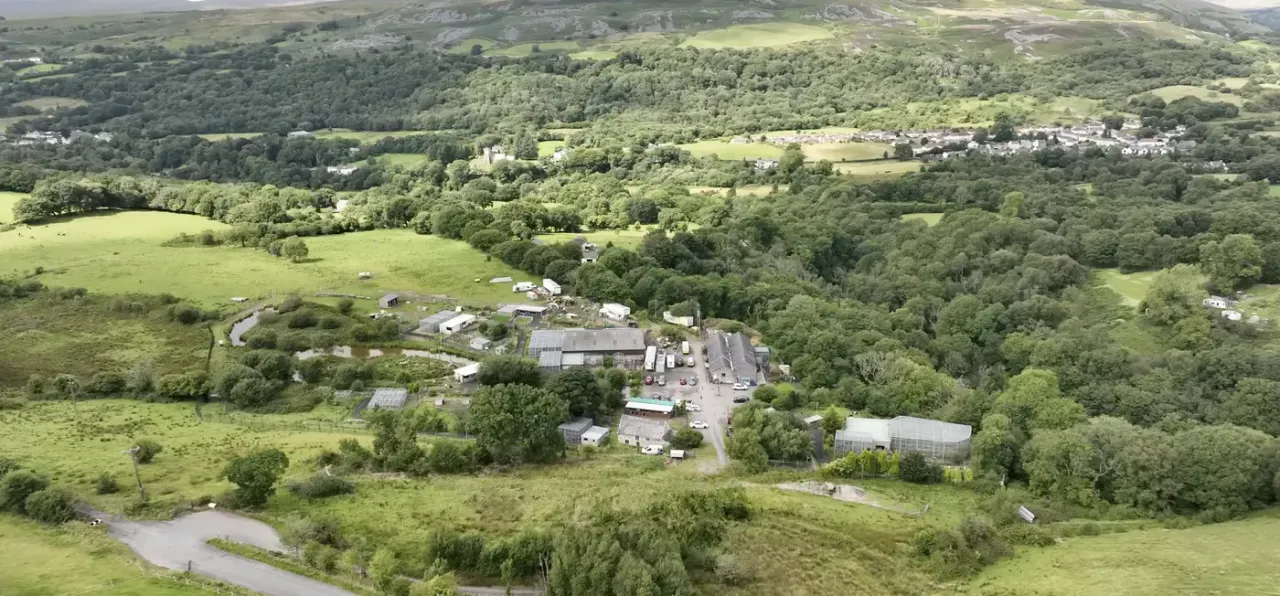 Aerial panoramic view of Wales Ape & Monkey Sanctuary in the Brecon Beacons valley